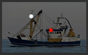 A fishing vessel NOT engaged in fishing (shows lights for a power-driven vessel under 50m underway)