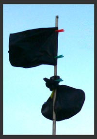 A distress signal improvised from bin liners and other materials to hand