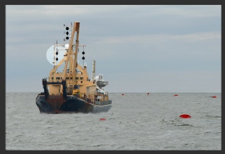 A vessel restricted in her ability to manoeuvre engaged in dredging or underwater operations with obstruction on her port side