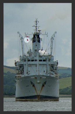 A Royal Fleet Auxiliary Flying International Flag H - "I have a pilot on board"