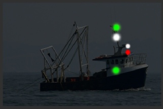 Trawler under 50m making way - seen from starboard - hauling nets